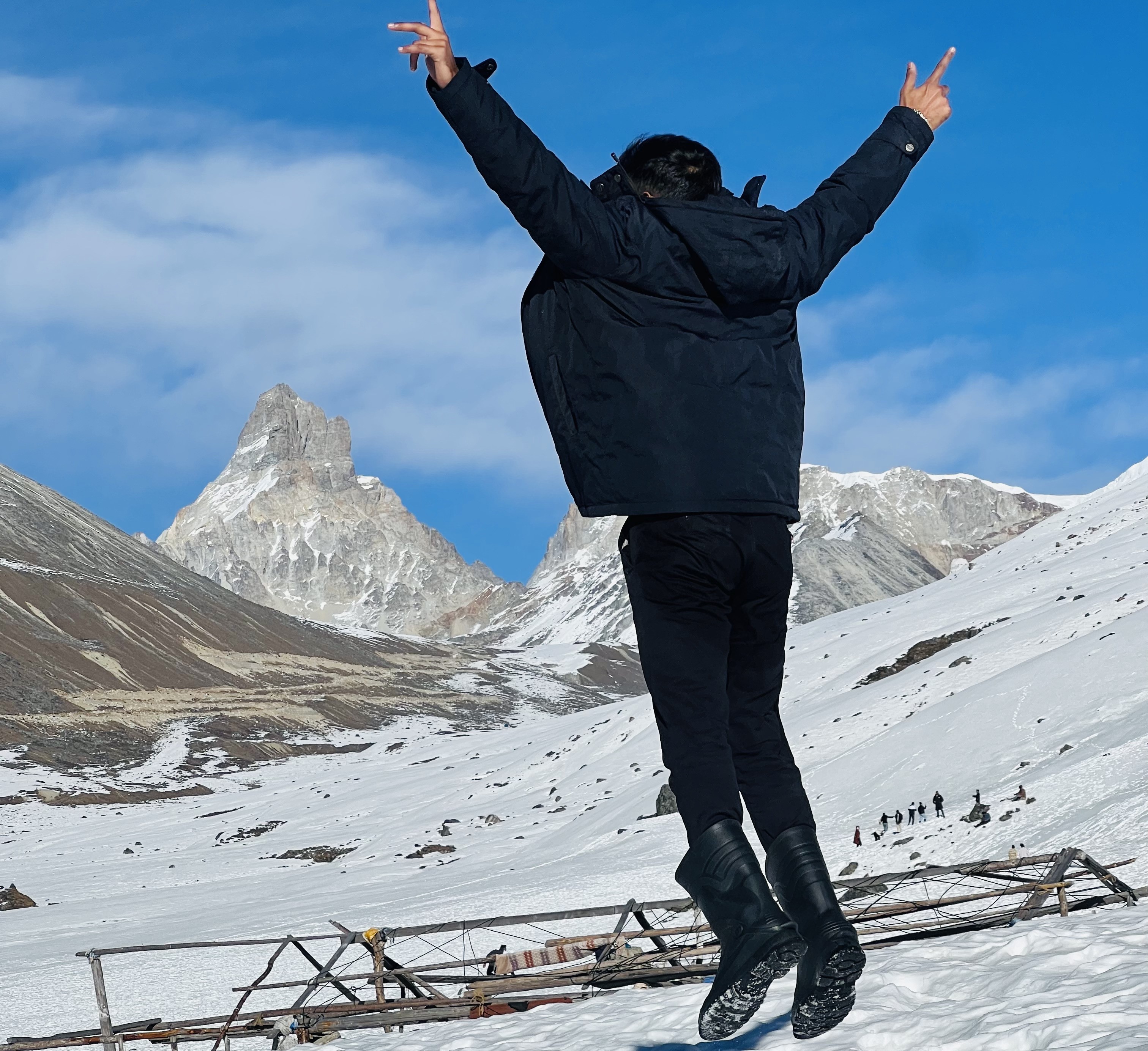 Man jumping in snowy mountain cinematic potrait